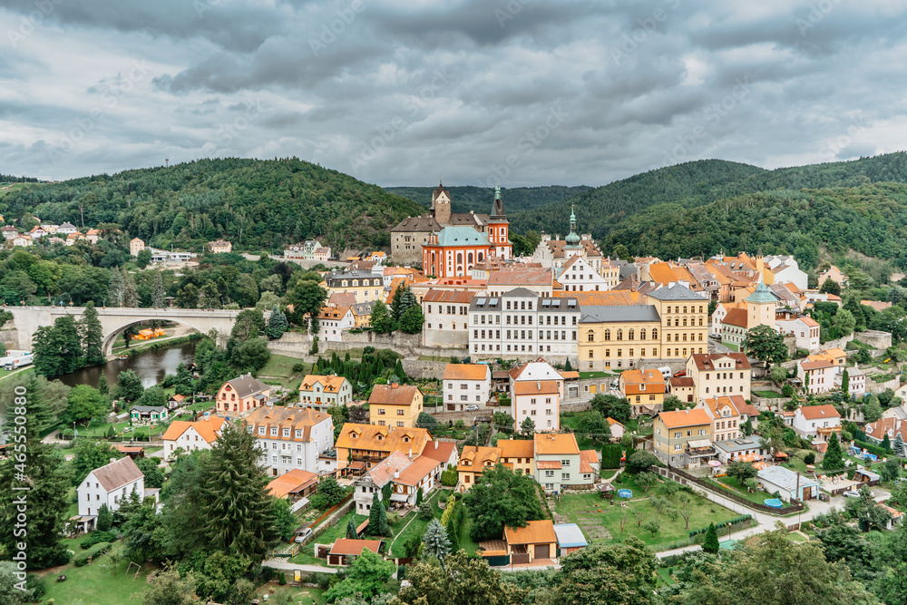 Panoramic view of famous medieval town of Loket,Elbogen, with colorful houses and stone castle above river,Czech Republic.Historical city centre is national monument.Travel architecture background