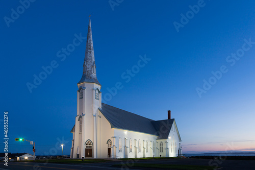 Blue hour sunset view of historic 1881 St. Pierre-de-la-Verniere Church in Cap-aux-Meules, Magdalen Islands, Quebec, Canada