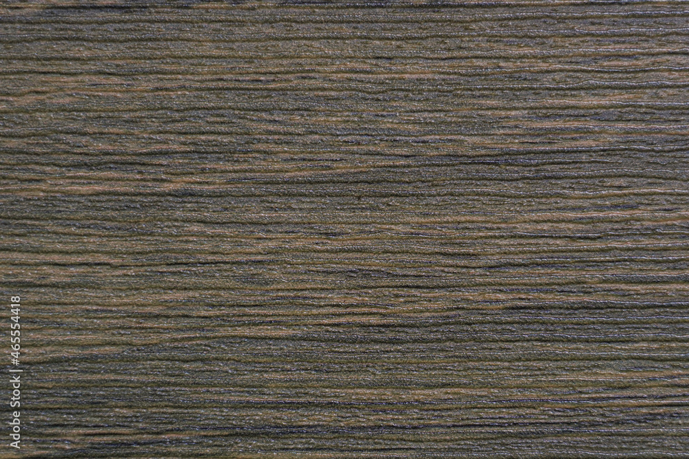 the abstract horizontal surface of the slick plywood in brown for a background pattern. a detailed element graphic for a creative design. the abstract horizontal surface of the slick plywood in brown for a background pattern. a detailed element graphic for a creative design.