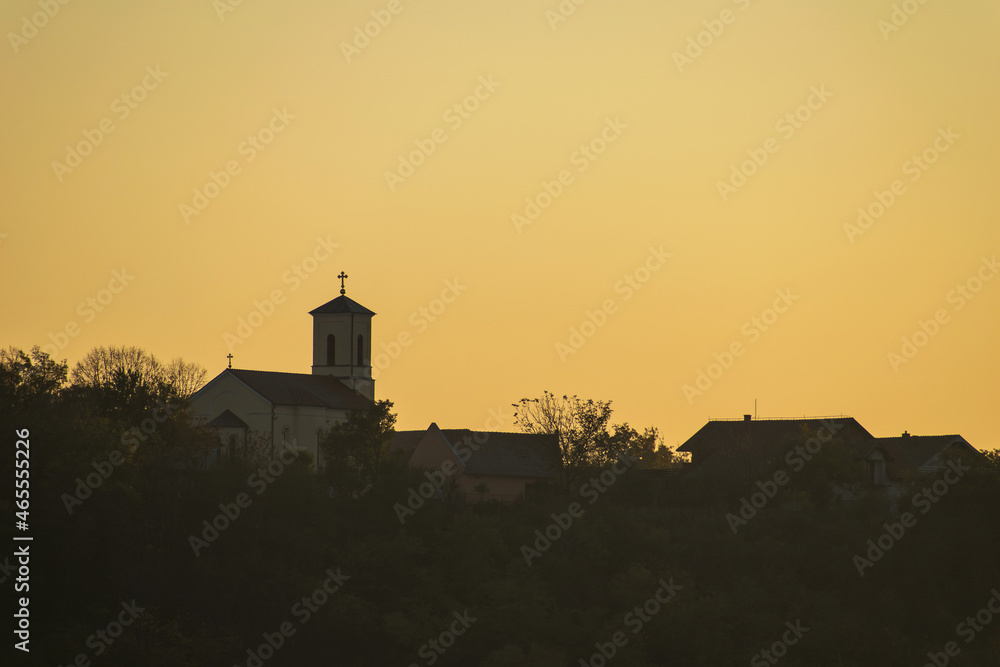 Orthodox church in the distance, in the sunlight at sunset. About religion, faith and hope - concept.