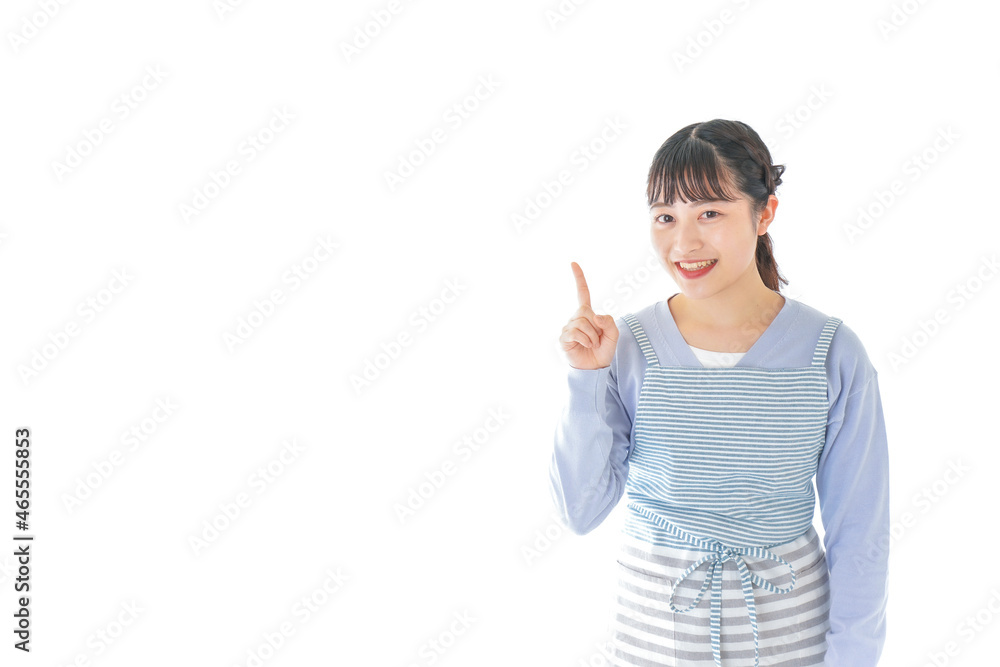 笑顔で指差す若い主婦 笑顔で指差す若い主婦