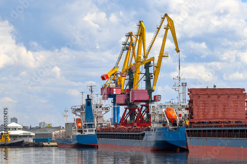 Kaliningrad commercial port. Large harbor cranes. Ships