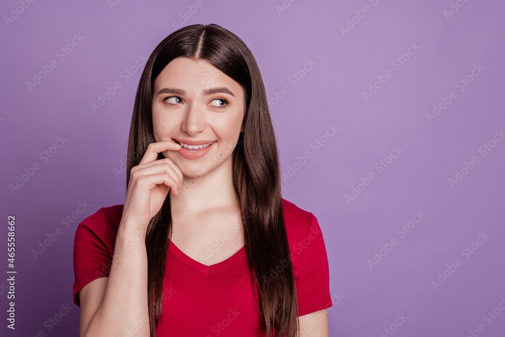 Photo of young attractive girl finger touch teeth flirty look empty space isolated over violet color background