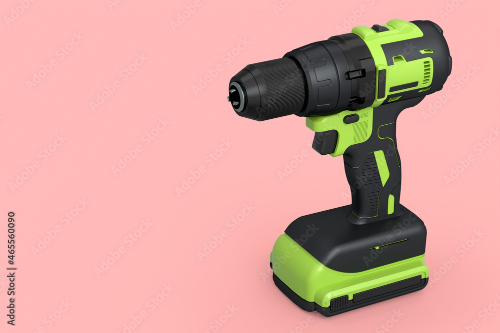Cordless drill or green screwdriver isolated on pink background Cordless drill or green screwdriver isolated on pink background