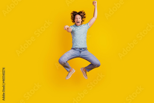 Full length body size photo of young guy jumping up imagine rodeo isolated vibrant yellow color background