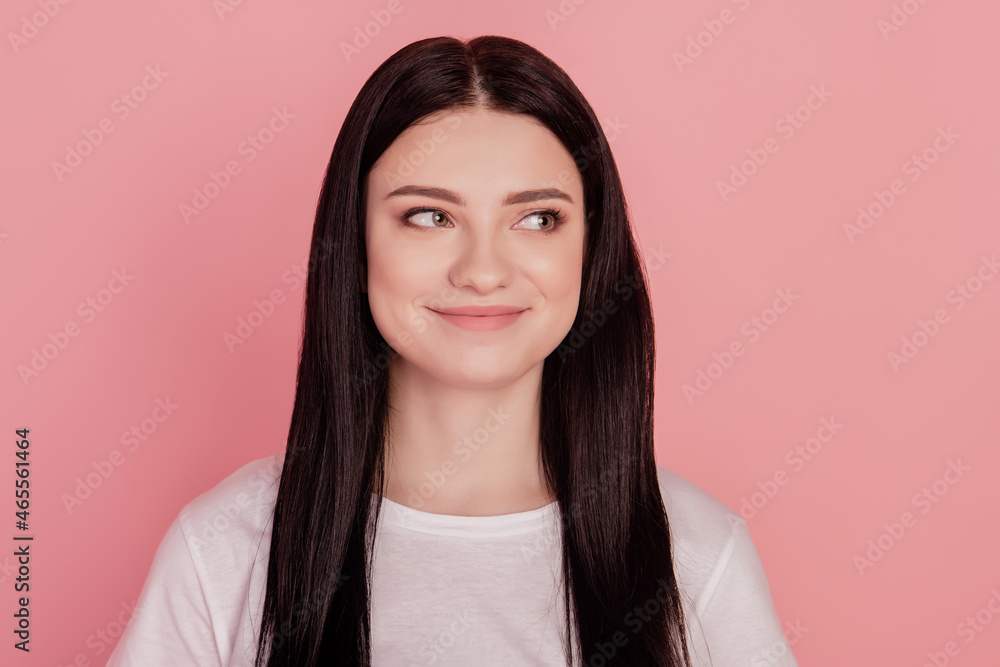 Photo of dreamy inspired cheerful lady look empty space isolated on pink color background Photo of dreamy inspired cheerful lady look empty space isolated on pink color background