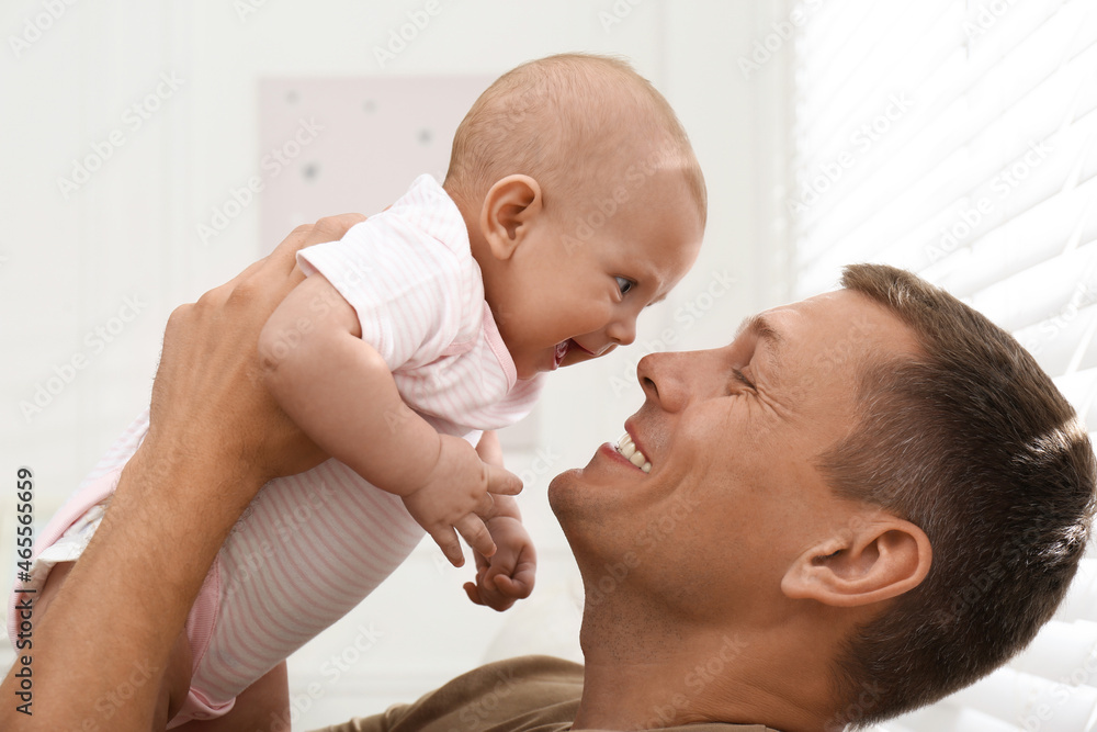 Happy father with his little baby at home Happy father with his little baby at home