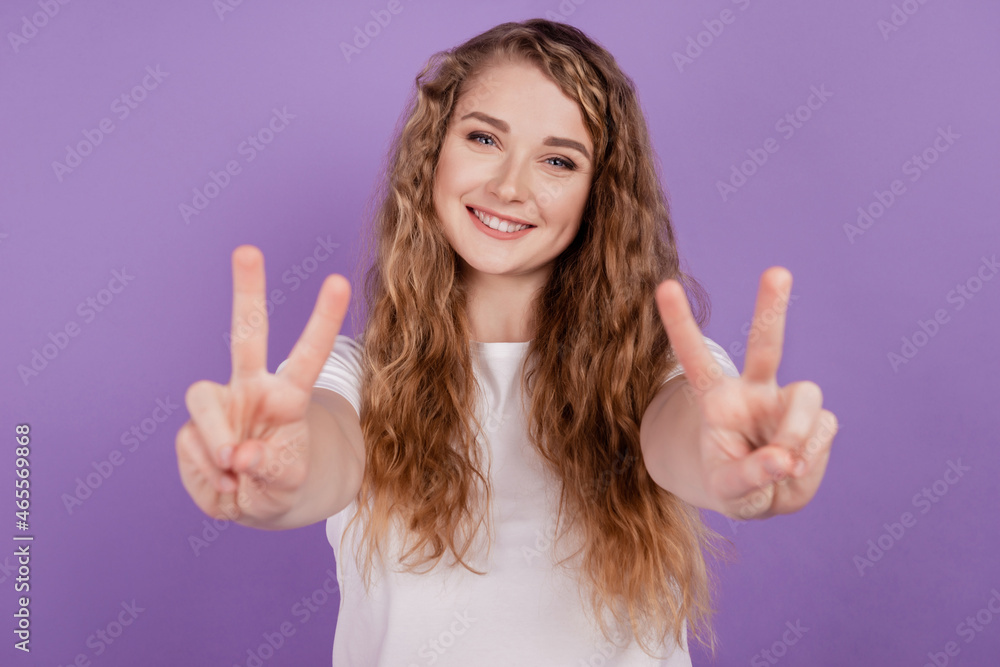 Photo of cheerful redhead lovely lady show v-sign wear casual outfit on violet background Photo of cheerful redhead lovely lady show v-sign wear casual outfit on violet background