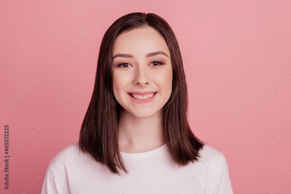 Photo of charming positive dream lady look camera toothy beaming smile isolated pink color background Photo of charming positive dream lady look camera toothy beaming smile isolated pink color background