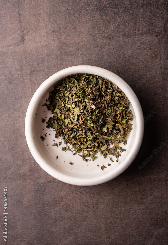 selective focus, natural green leaf tea. brewing in a clay bowl. vertical angle, macro. on a dark background. for menus and cafes selective focus, natural green leaf tea. brewing in a clay bowl. vertical angle, macro. on a dark background. for menus and cafes