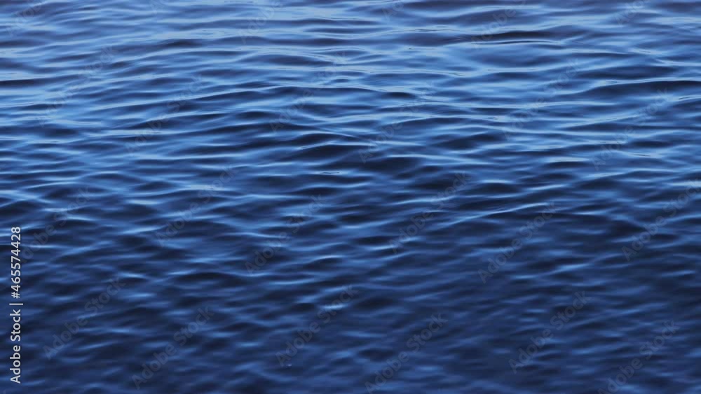Blue calming wave texture. Sea background. Lake close up. Blue calming wave texture. Sea background. Lake close up.
