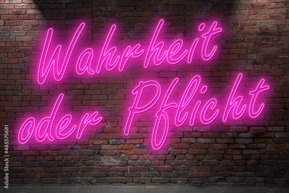 Neon erotic game Truth or Dare (in german Wahrheit oder Pflicht) lettering on Brick Wall at night