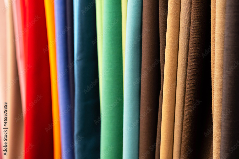 Set of samples fabric, selective focus. Multicolored stripes abstract background. Fabric store.