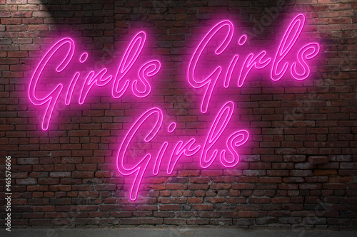 Neon Girls Girls Girls lettering on Brick Wall at night