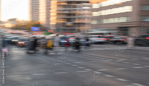 Blurred Crowd of unrecognizable people walking on Zebra crossing.Cityscape.