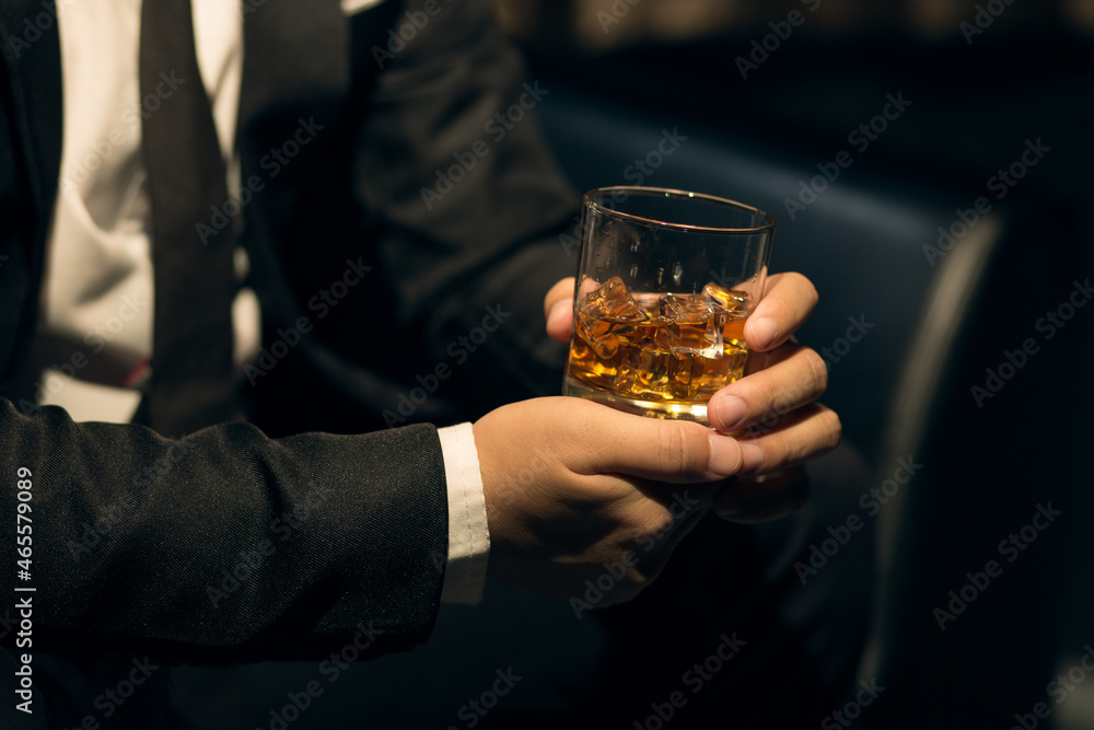 Businessmen in suits drinking whiskey Businessmen in suits drinking whiskey