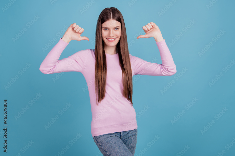 Portrait of energetic positive cheerful girl point thumb finger herself impressed wear good look clothes isolated over blue color background Portrait of energetic positive cheerful girl point thumb finger herself impressed wear good look clothes isolated over blue color background