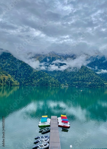 Lake Ritsa Abkhazia, mountains, fog. Catamaran parking
