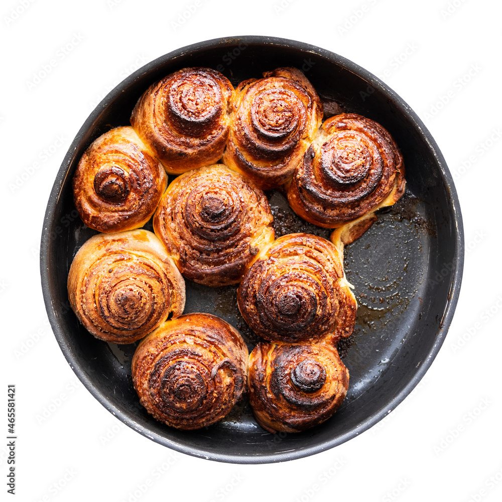 top view of homemade fresh baked cinnamon buns in round baking dish cutout on white background