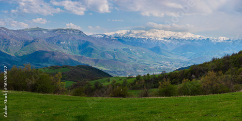 Panoramic view of the outskirts of Ijevan with snowy mountains and forest, Armenia