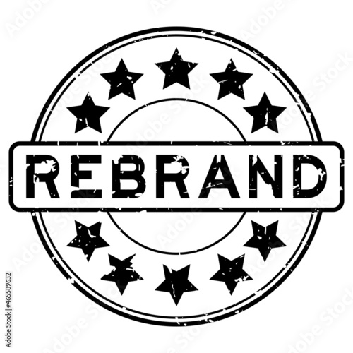 Grunge black rebrand word with star icon round rubber seal stamp on white background