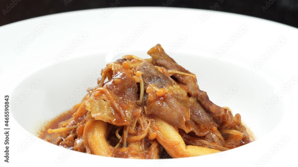 Chinese style home-cooked beef with golden needles and beef mushrooms Chinese style home-cooked beef with golden needles and beef mushrooms