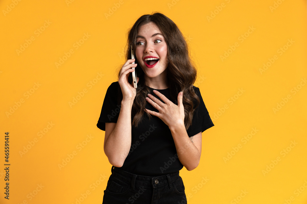 White excite woman gesturing while talking on mobile phone White excite woman gesturing while talking on mobile phone