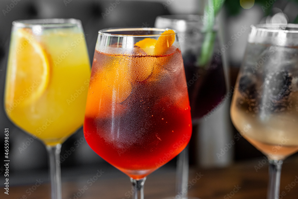 Aperitif is a refreshing cocktail of lemonade made from citrus slices. Soft drink with syrup and soda and ice cubes. Concept - summer thirst Aperitif is a refreshing cocktail of lemonade made from citrus slices. Soft drink with syrup and soda and ice cubes. Concept - summer thirst