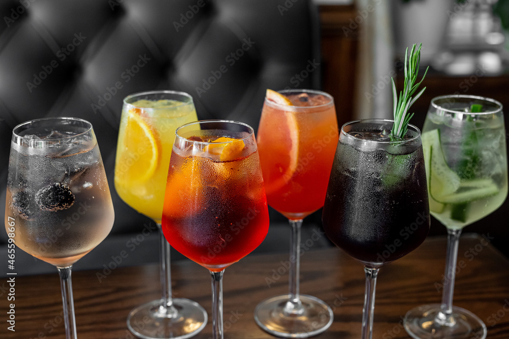 Aperitif is a refreshing cocktail of lemonade made from citrus slices. Soft drink with syrup and soda and ice cubes. Concept - summer thirst Aperitif is a refreshing cocktail of lemonade made from citrus slices. Soft drink with syrup and soda and ice cubes. Concept - summer thirst