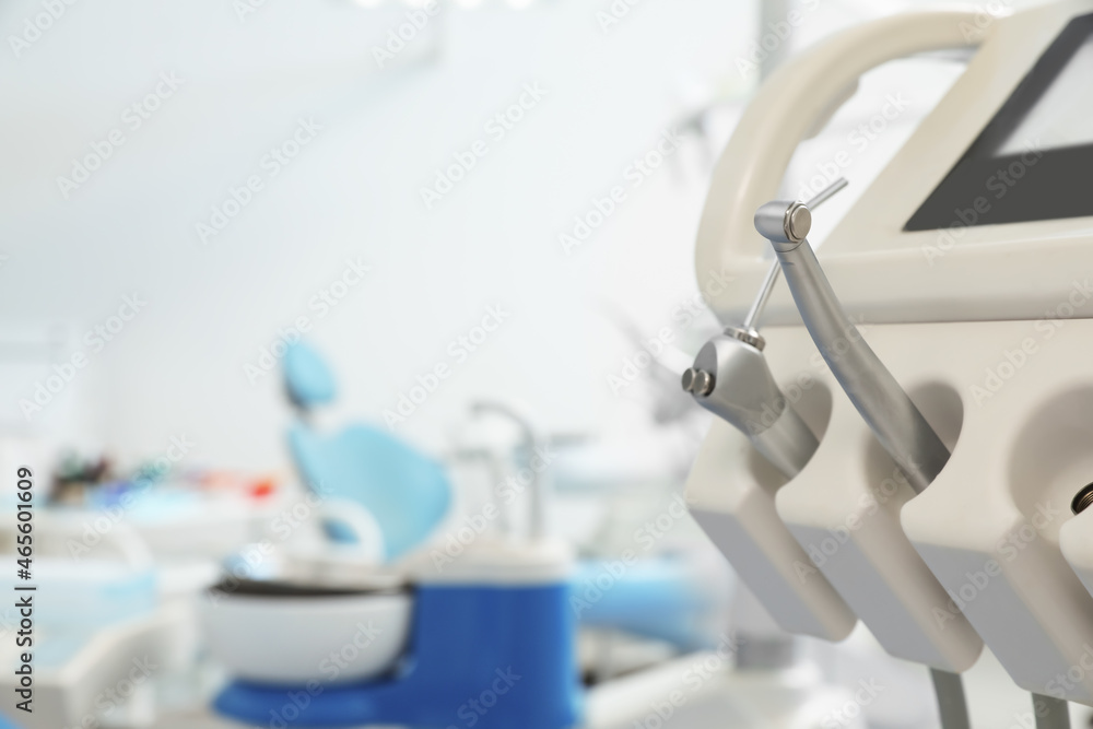 Professional equipment in dentist's office, space for text Professional equipment in dentist's office, space for text