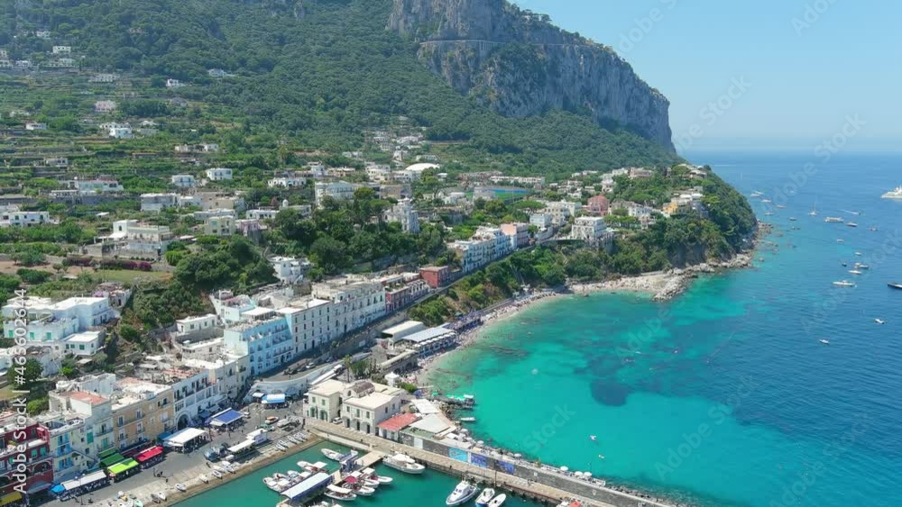 Capri, Italy: Aerial view of famous Italian island near Naples, north region Marina Grande, clear turquoise sea water and beach Spiaggia di Cala Grande - landscape panorama of Europe from above Capri, Italy: Aerial view of famous Italian island near Naples, north region Marina Grande, clear turquoise sea water and beach Spiaggia di Cala Grande - landscape panorama of Europe from above