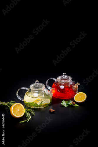 A teapot with black and green tea from various varieties of leaves. Tea drink with pieces of citrus fruits. concept is a tea ceremony.