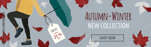 Horizontal banner for autumn-winter fashion new collection. With woman posing with a yellow coat, boots and blue umbrella. Promo background with autumn foliage falling like maple leaf in red and white