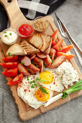 bruschetta with tomato, sausages and eggs