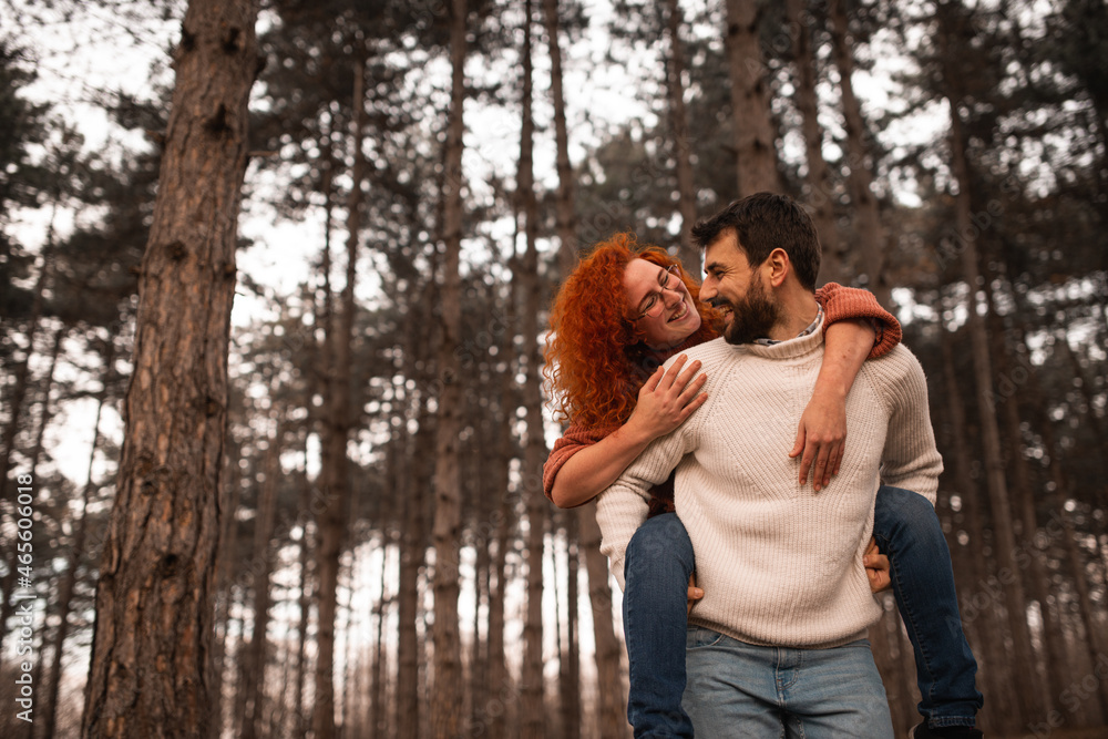 Couple in love hugging and enjoying at public park in autumn Couple in love hugging and enjoying at public park in autumn