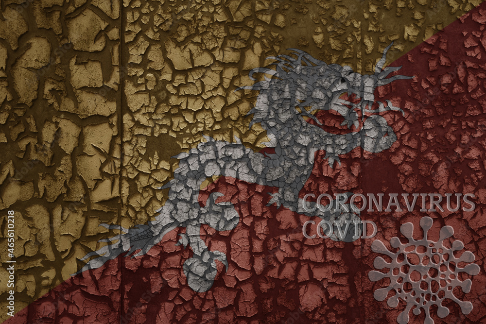 Fototapeta premium flag of bhutan on a old metal rusty cracked wall with text coronavirus, covid, and virus picture.