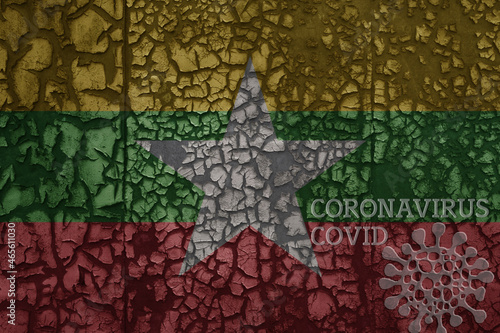 flag of myanmar on a old metal rusty cracked wall with text coronavirus, covid, and virus picture.