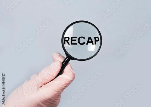 medical recap concept. Summary and review through magnifying lens in doctor hand.