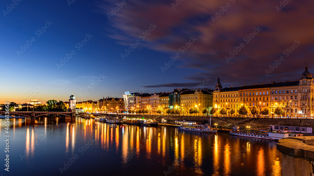 Prague's waterside by the Vltava river called Prazska naplavka in twilight.