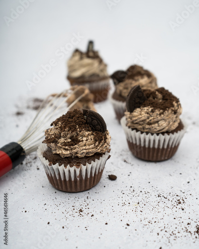 oreo cupcakes on a marble background with a whisker
