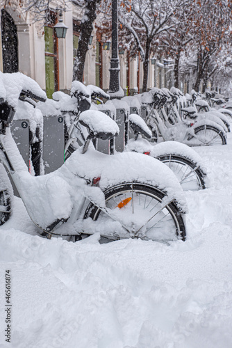 Bicycles parked and covered with snow in winter