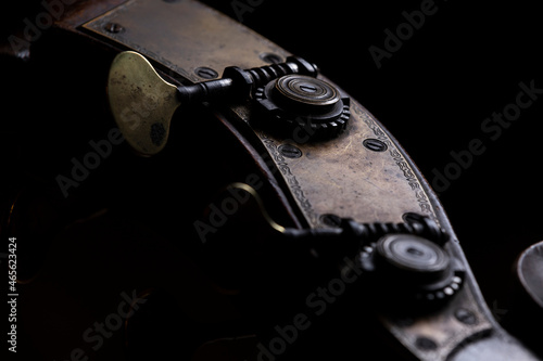The tuning machine head with tuning keys or machine pegs of a acoustic wood double bass. A common instrument in classical and jazz music.