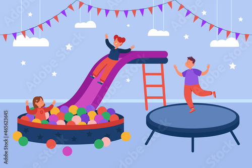 Kids playing games on playground of indoor play center. Children jumping in ball pool and trampoline of recreation zone in shopping mall flat vector illustration. Happy childhood, day care concept