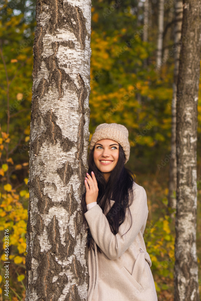 Portrait of a joyful young woman enjoying in the autumn park. Portrait of a joyful young woman enjoying in the autumn park.