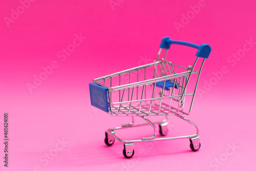 A Shopping Cart Isolated On pink background