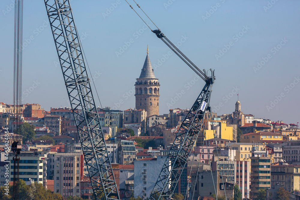 istanbul, turkey, october 14, 2012: Galata Tower with all its beauty among the cranes