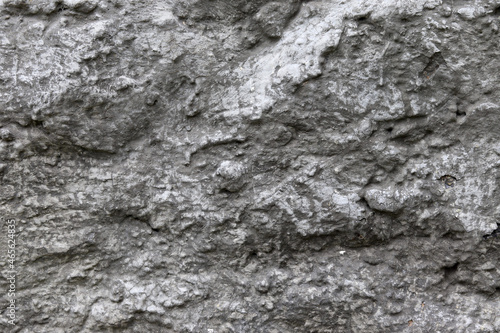 Stone background. The texture of a stone wall. Close-up. Light gray stone background.