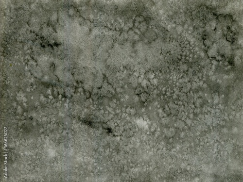 Light watercolor textured background of silver-black color with speckles. Salt Effects