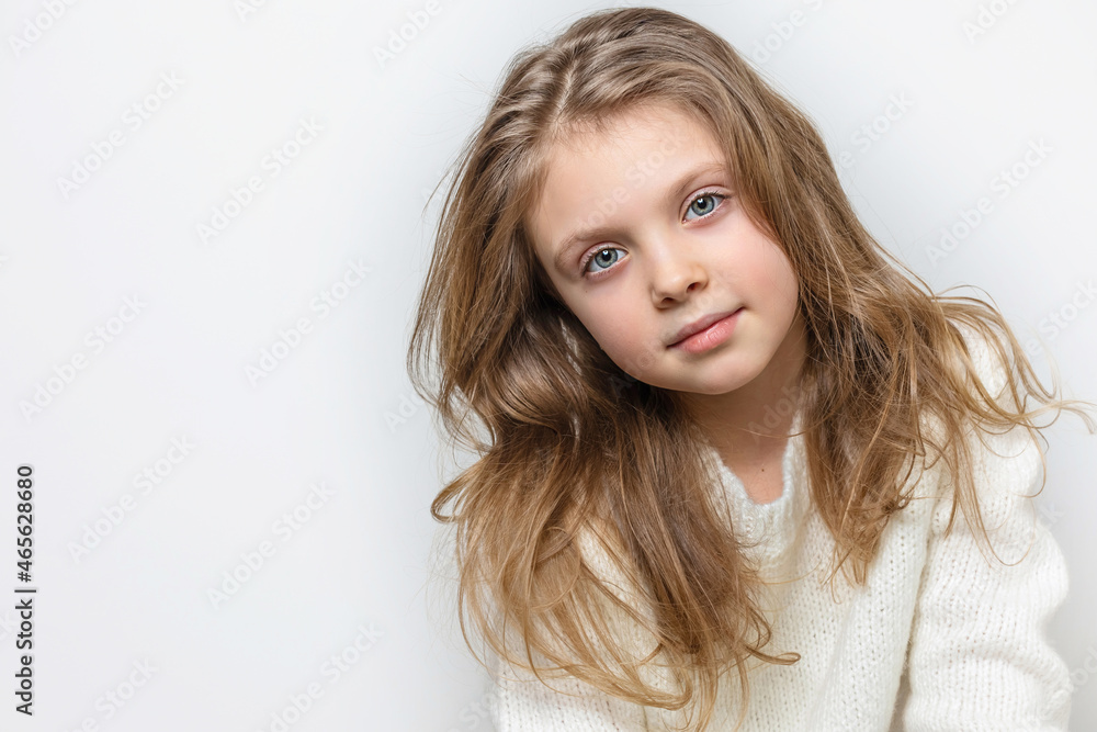 Portrait of beautiful happy smiling little girl on a white background, banner. Copy space for text Portrait of beautiful happy smiling little girl on a white background, banner. Copy space for text