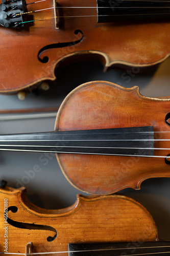 A top down view of multiple violins or violas that are common instrument of a classical orchestra